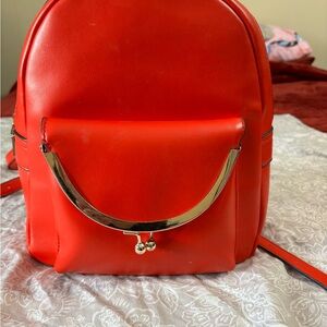 Chic Scarlet Backpack with Gold Accents